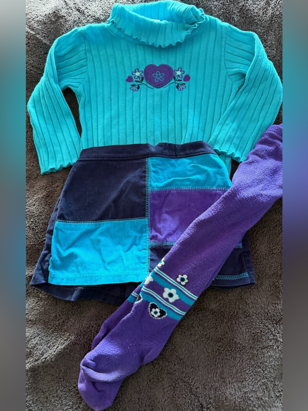 Child’s Turquoise Knit Ruffle-Neck Top with Playful Patchwork Skort/stockings